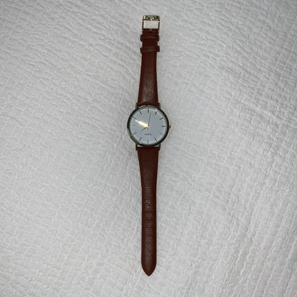 Gold and tan leather watch